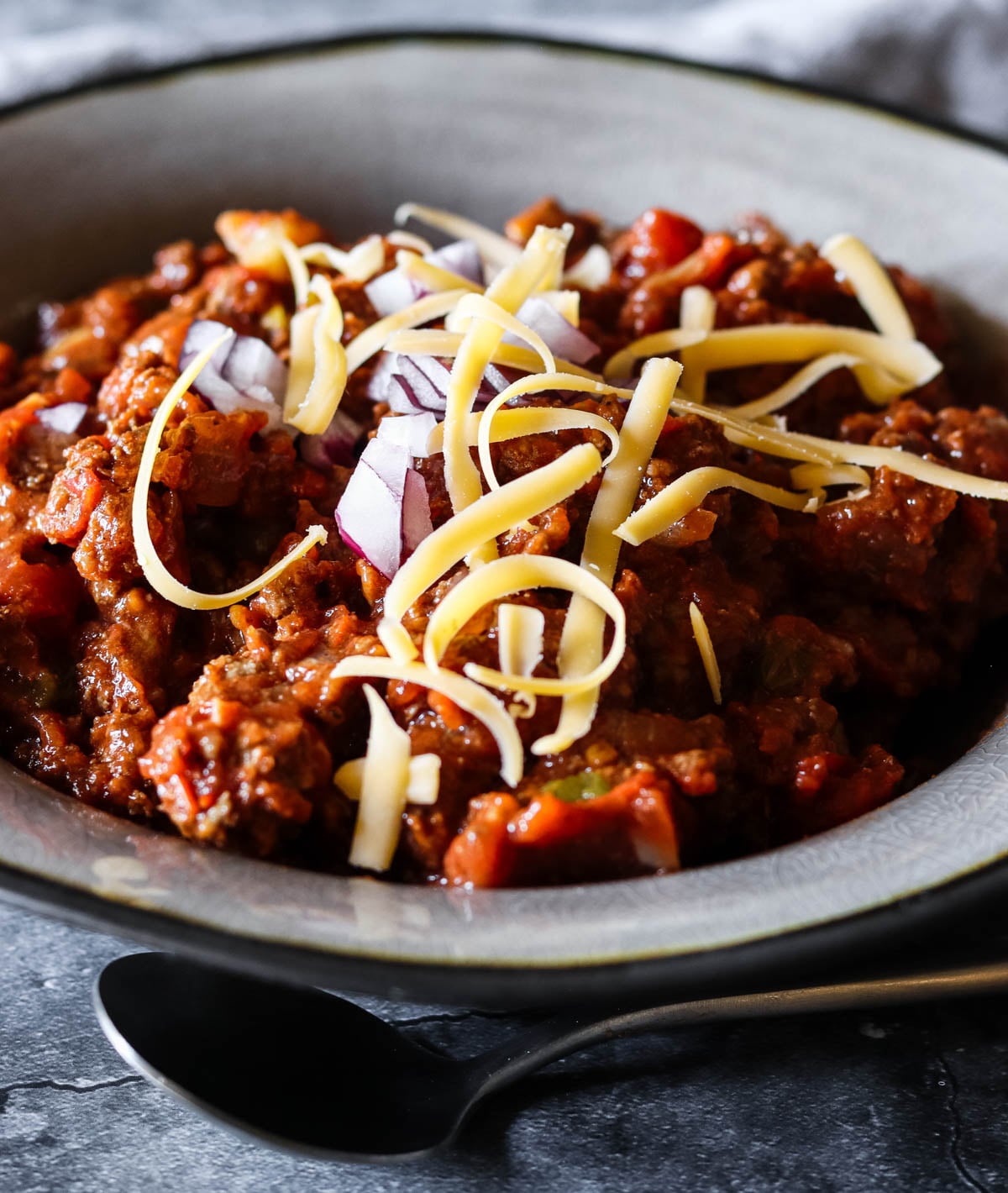 No bean chili in a gray bowl.