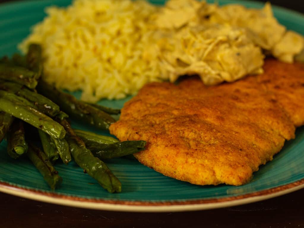 close up of chicken and green beans