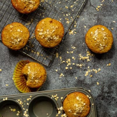 peanut butter banana oat muffins on a baking rack