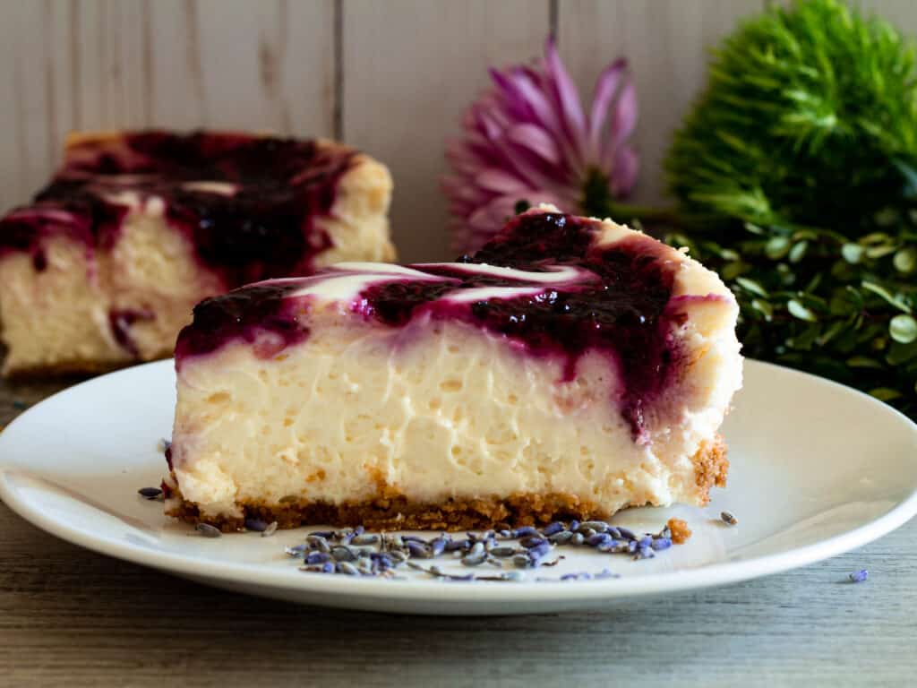 slice of blackberry cheesecake on a plate