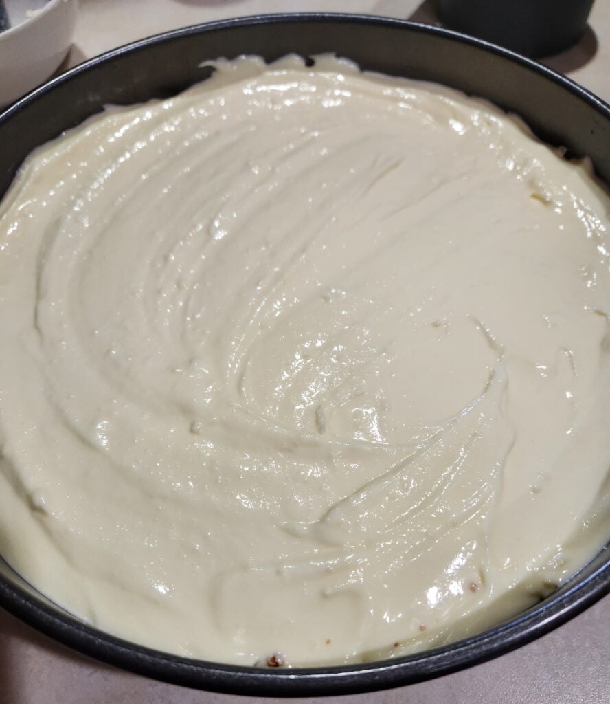 Cheesecake batter in a springform pan.