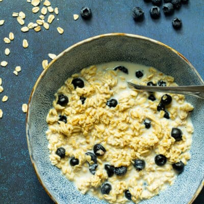 blueberry overnight oats in a blue bowl