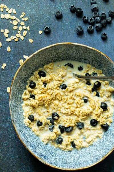 blueberry overnight oats in a blue bowl
