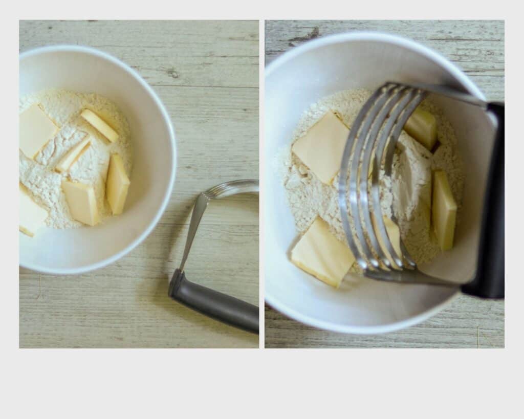 bowl of flour with butter and a pastry blender