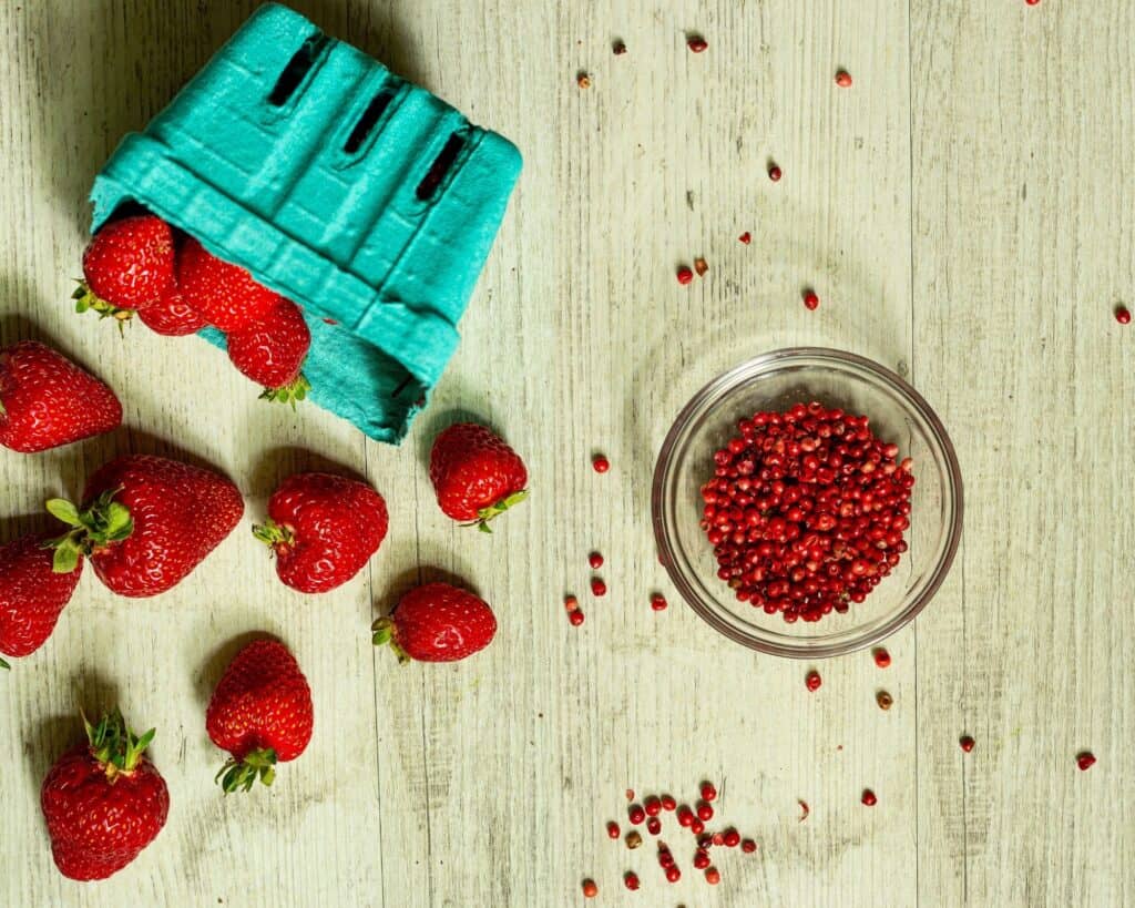 fresh strawberries and pink peppercorns