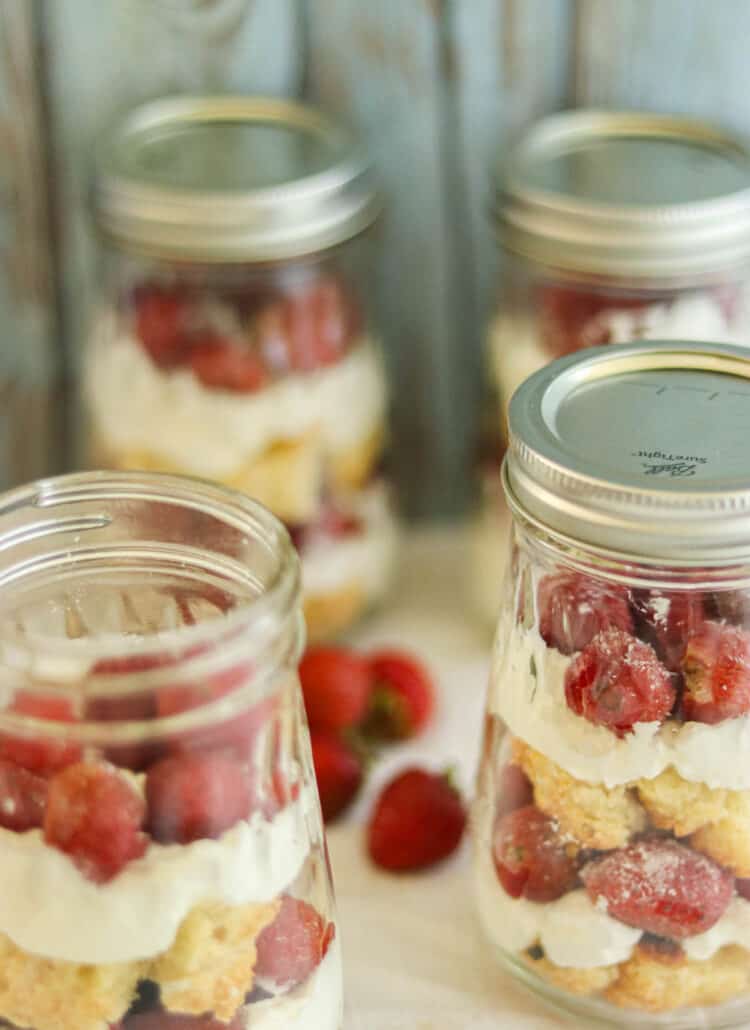four jars with strawberry shortcake