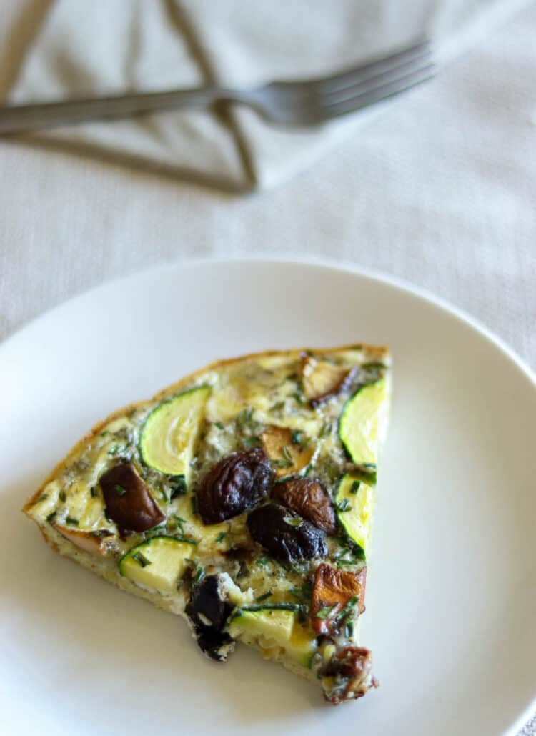 slice of frittata on a white plate.
