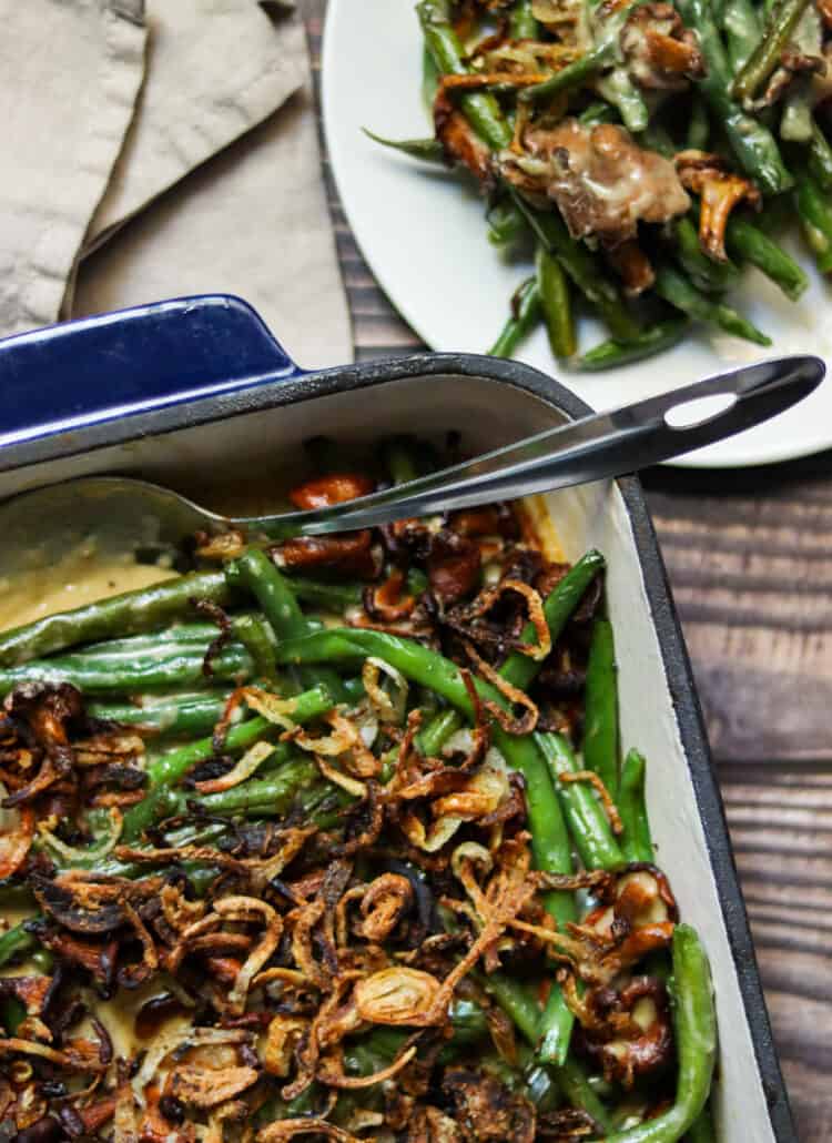 green bean casserole in a dish next to a plate.