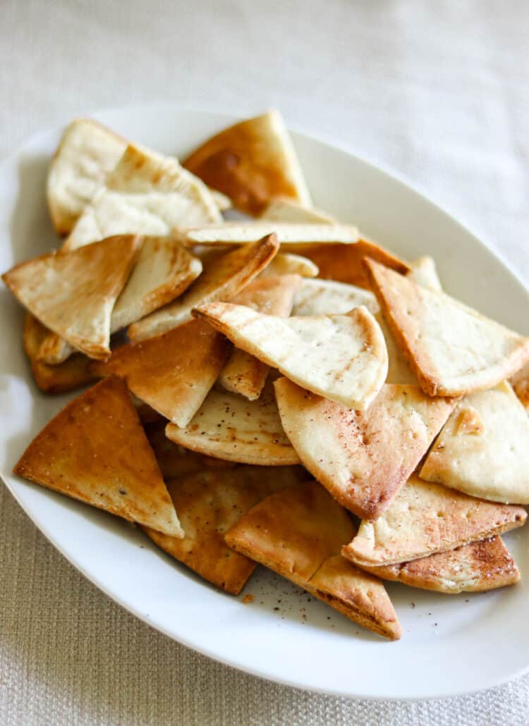 Air fried pita chips on a plate.