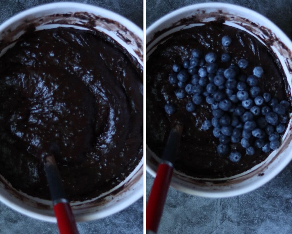 adding the blueberries to the batter.