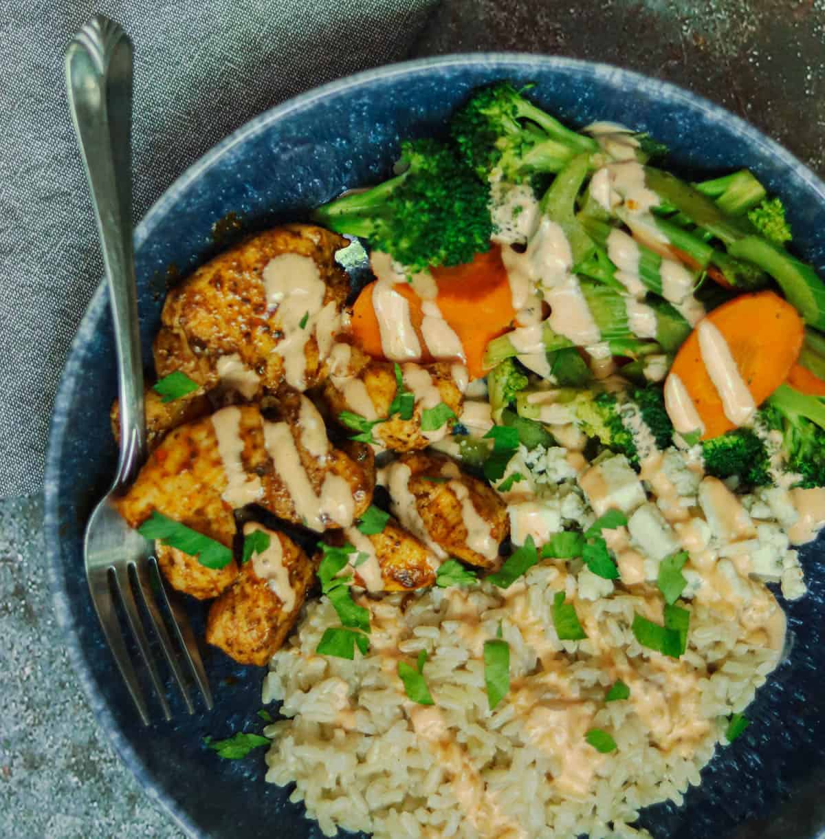 Rice bowl with a fork and napkin.