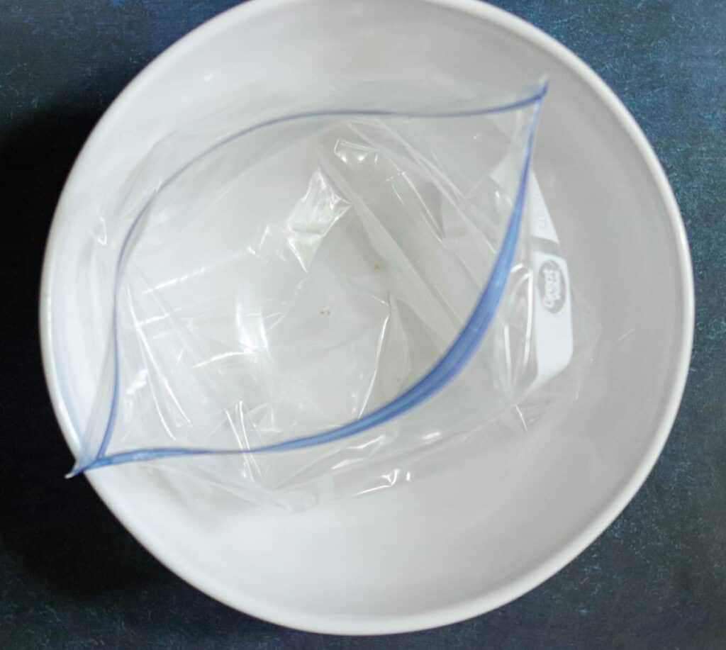 Freezer bag inside a large bowl.