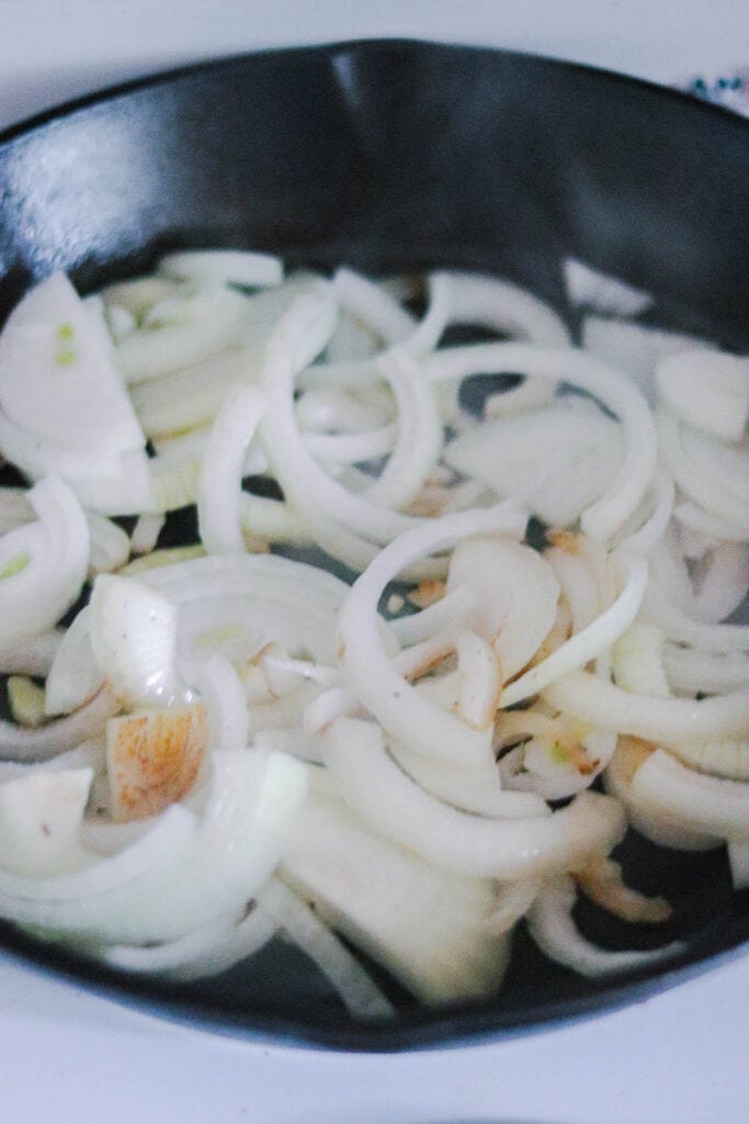 Add the onions to the skillet to brown them.