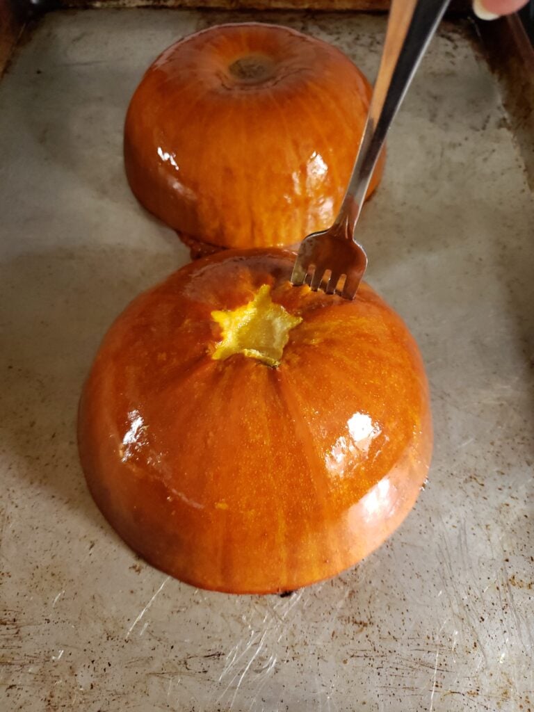 Testing doneness of pumpkins with a fork.