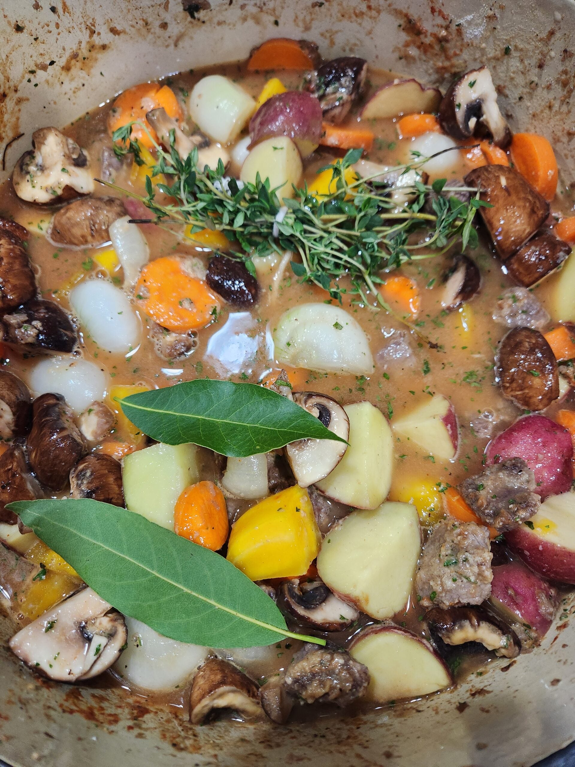 Fresh Thyme and Bay Leaves in the pot of tew.