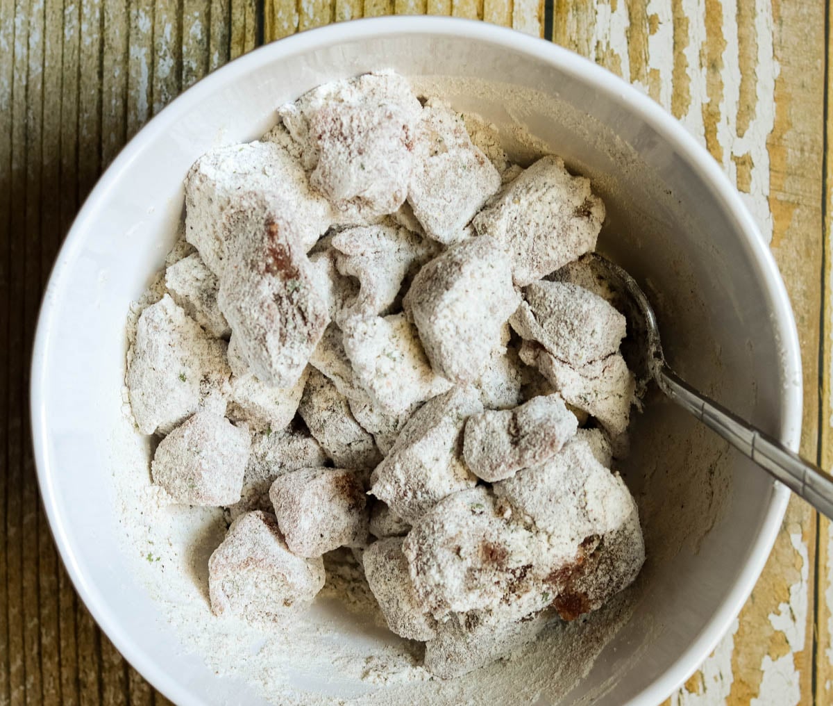 Stew meat tossed in the flour.