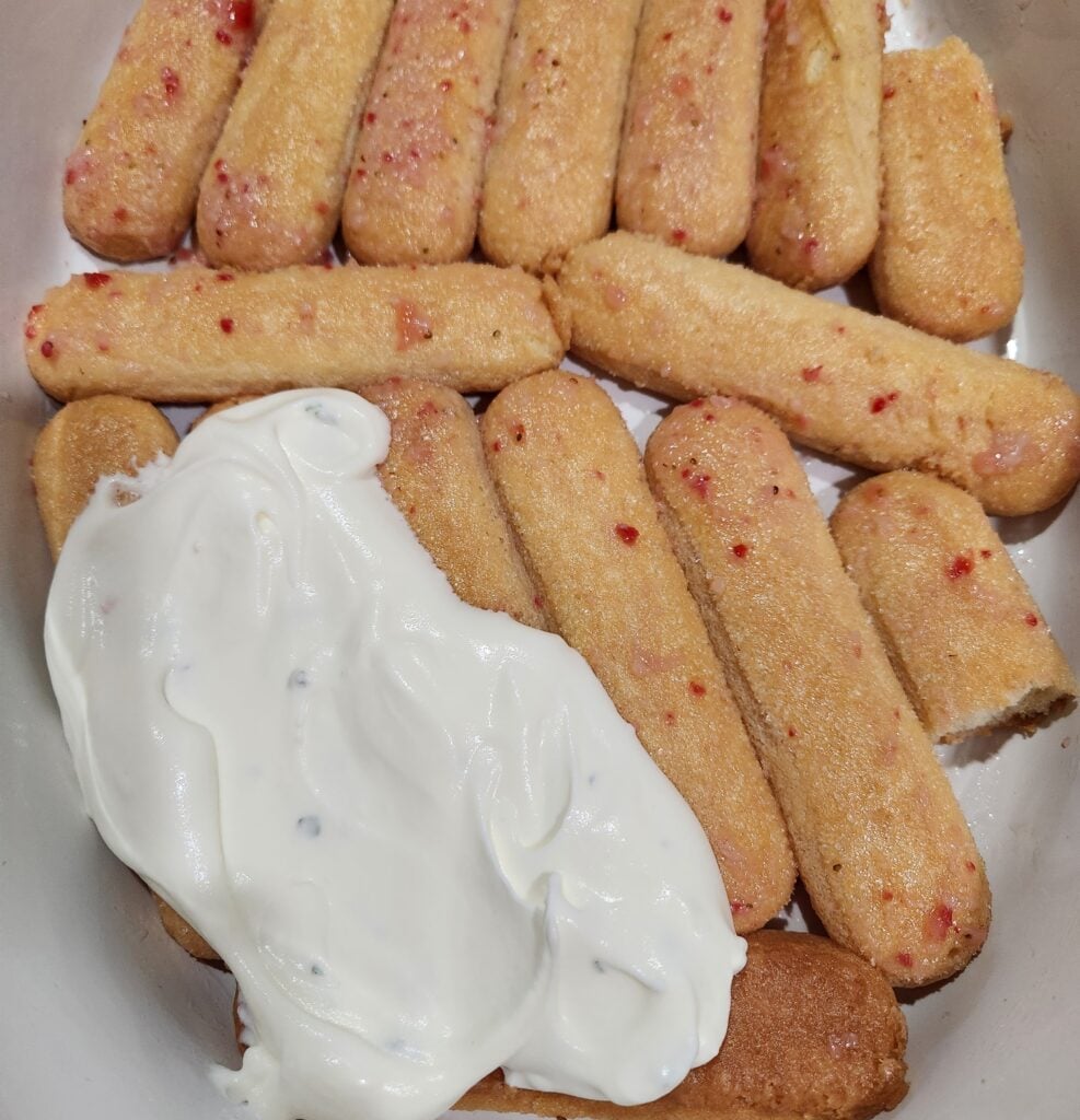 Assembling the tiramisu.