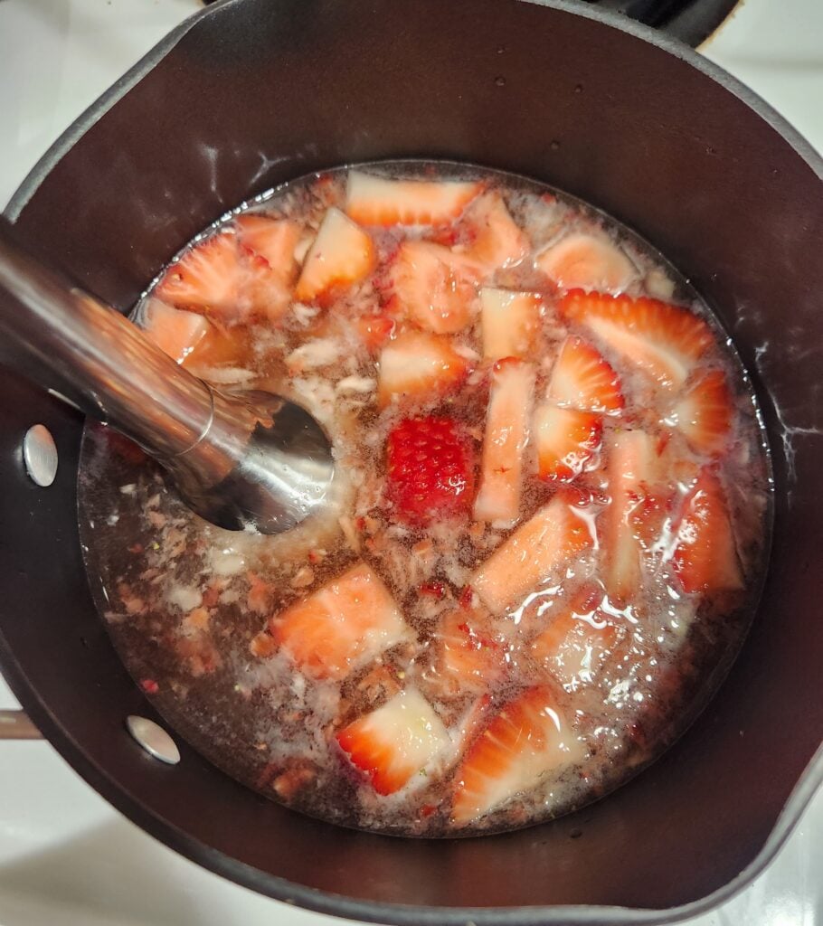 Pureeing the strawberries.