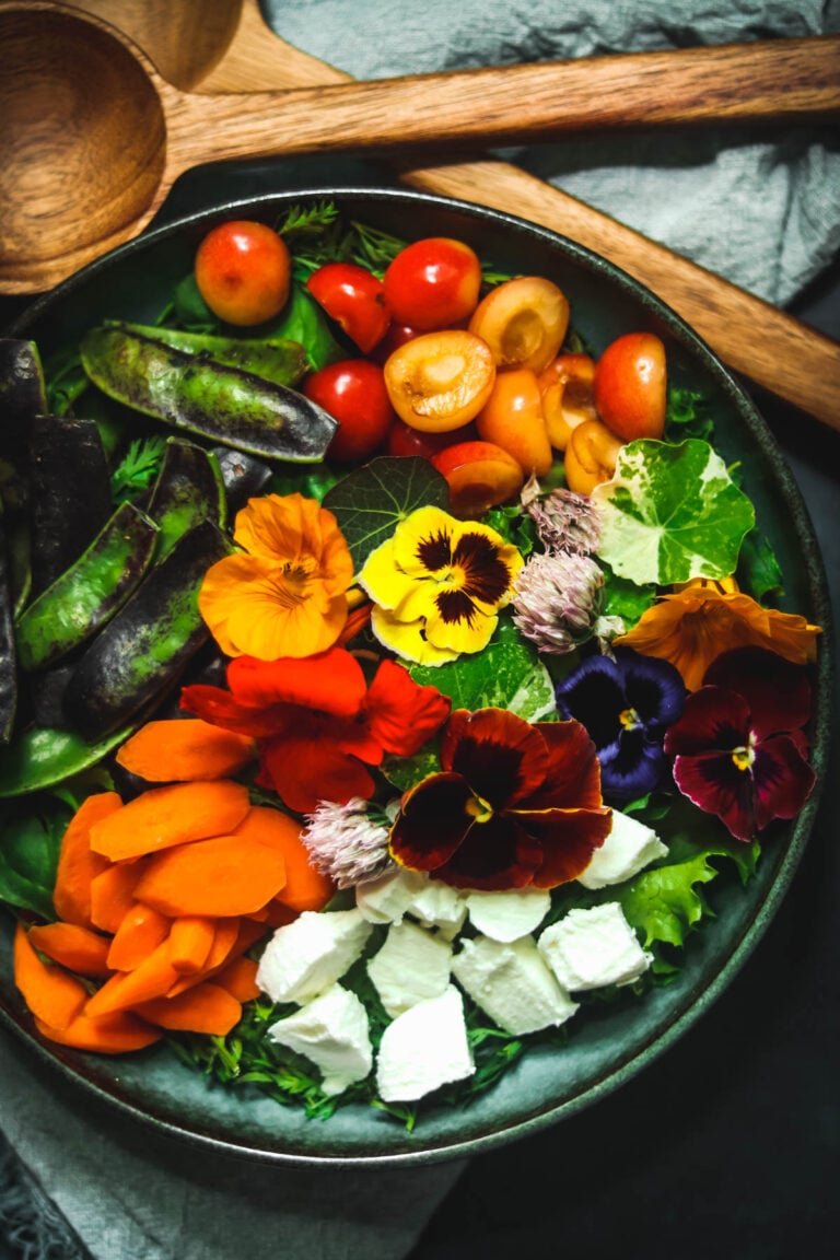 Salad in a green bowl.