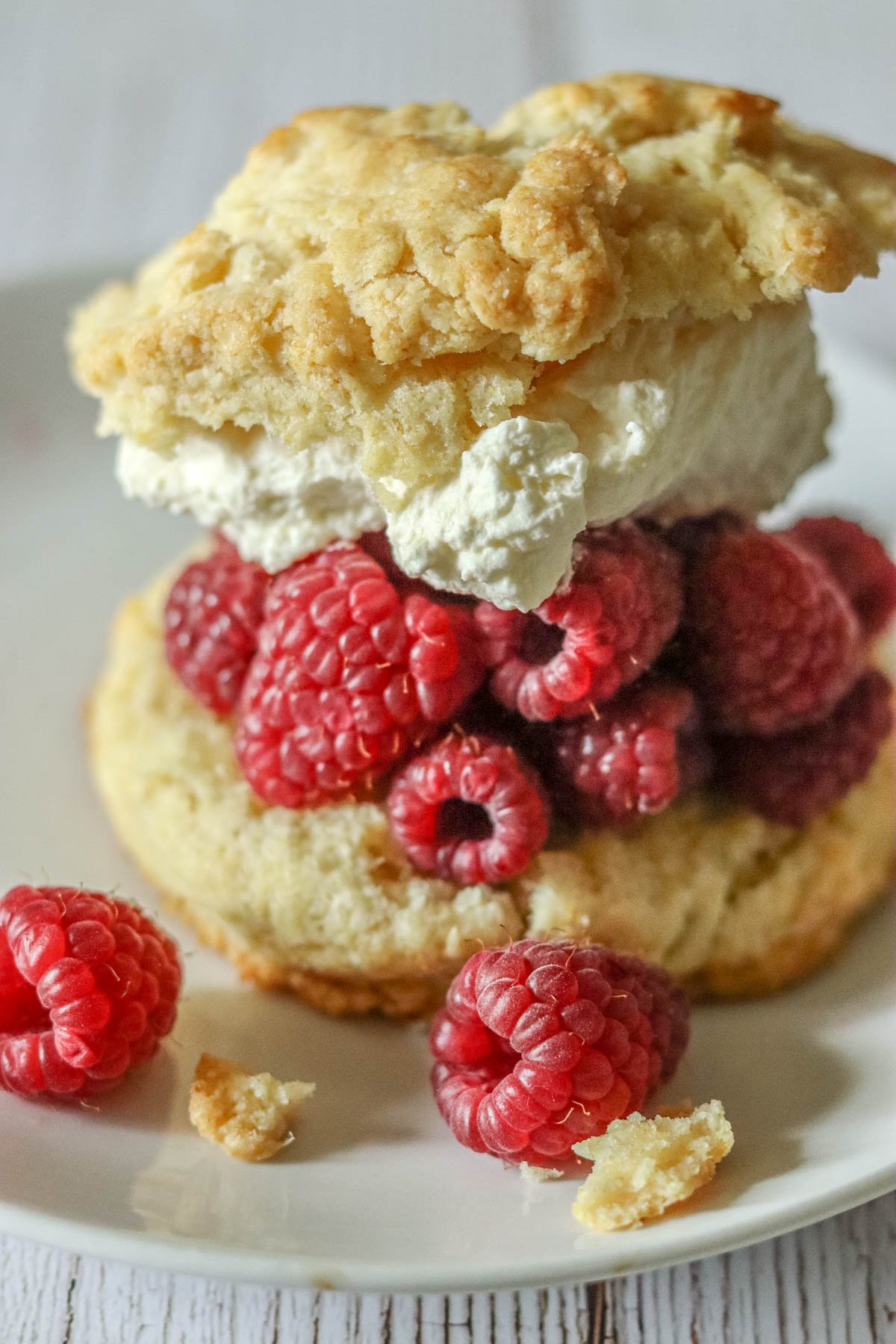 Easy Raspberry shortcake with whipped cream on a plate.