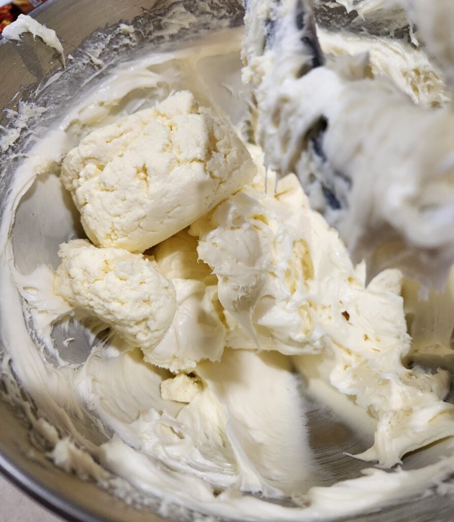 Adding ricotta and buttermilk to the mixer.