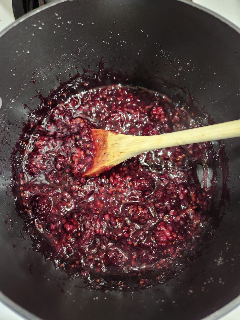 Blackberry sauce in a saucepan.