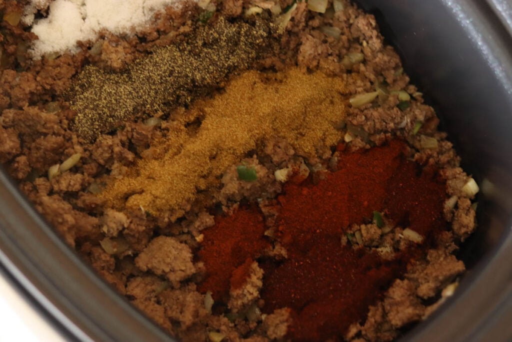 Add the spices to the chili.