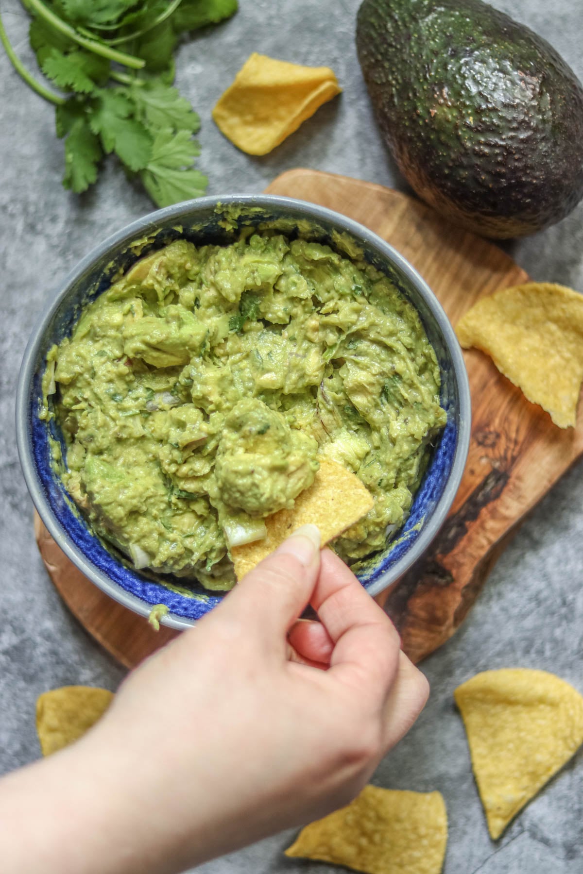 Guacamole with salsa verde and lime with chips.