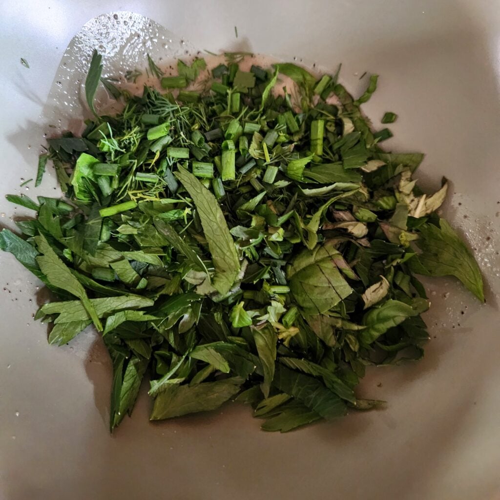 Herbs added to the vinaigrette.